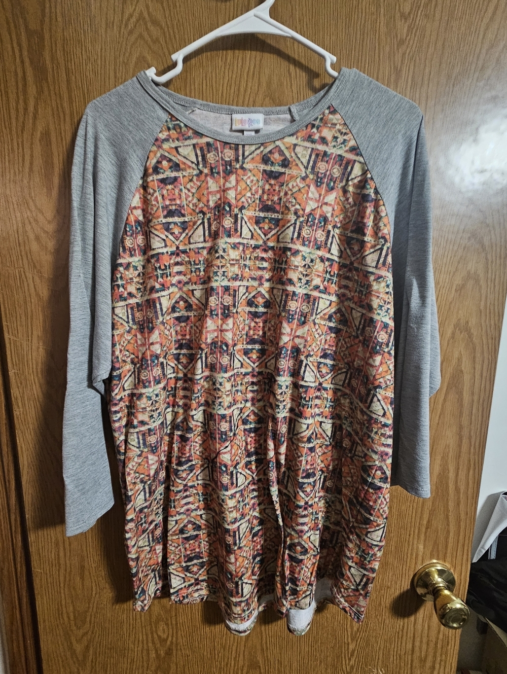 LuLaRoe Gray Sleeve Top with Orange Multi-Pattern Front